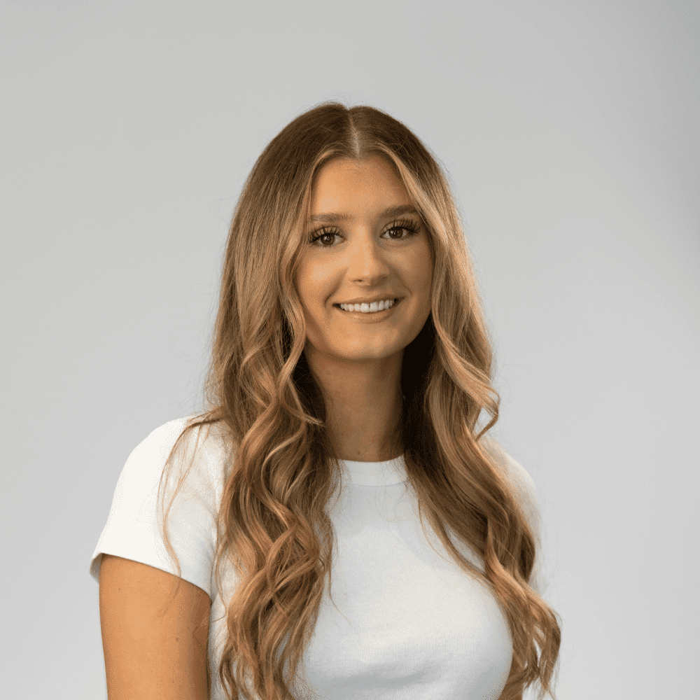 Portrait of Charlotte Parmenter, a professional stylist at Michael Anthony Salon, showcasing their expertise and style.
