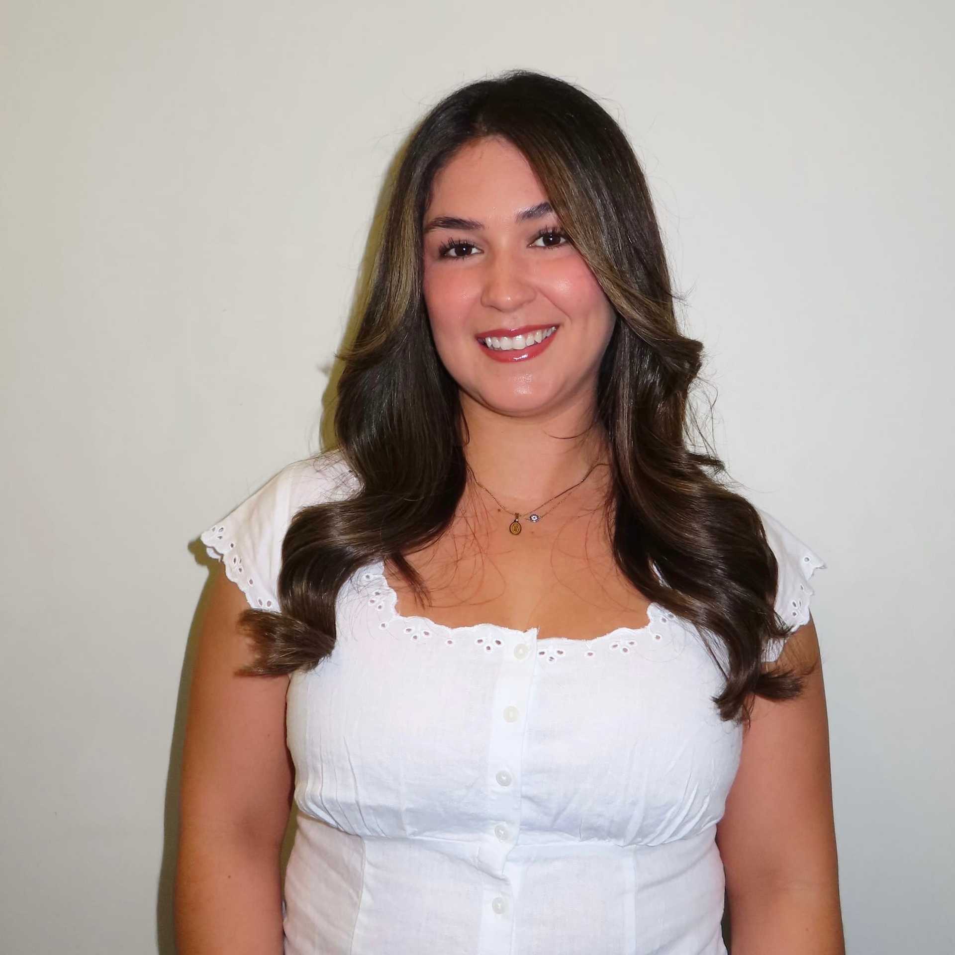 Portrait of Jesenia Munoz, a professional stylist at Michael Anthony Salon, showcasing their expertise and style.