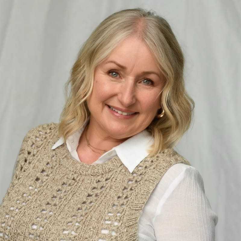 Portrait of Rona Ashby, a professional stylist at Michael Anthony Salon, showcasing their expertise and style.