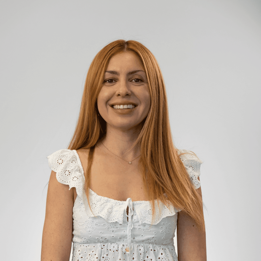 Portrait of Jovina Baker, a professional stylist at Michael Anthony Salon, showcasing their expertise and style.