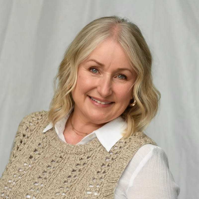 Portrait of Rona Ashby, a professional stylist at Michael Anthony Salon, showcasing their expertise and style.